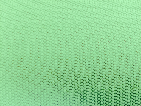 painted rubber as background, rough surface, green backgroundの写真素材
