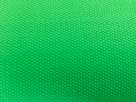 painted rubber as background, rough surface, green backgroundの写真素材