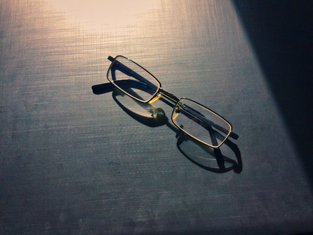 glasses on a dark background, shadow of the rim, metallic materialの写真素材
