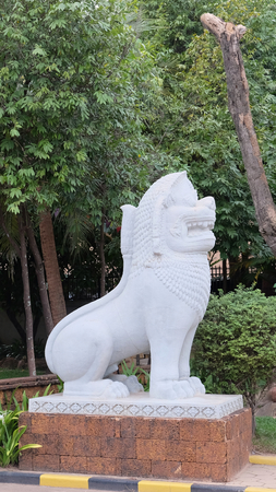 white statue of a lion, ornamental vegetation, Asian culture
