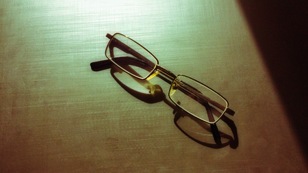 glasses on a dark background, shadow of the rim, metallic materialの写真素材