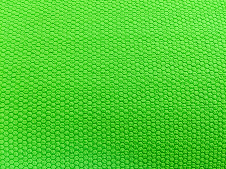 painted rubber as background, rough surface, green backgroundの写真素材