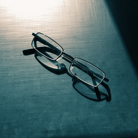 glasses on a dark background, shadow of the rim, metallic materialの写真素材