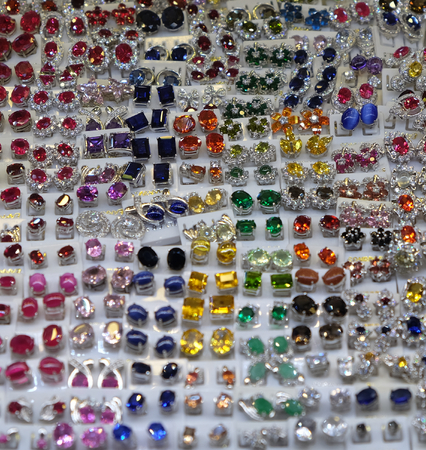 women's rings with precious stones, women's jewelry, a large number of jewelry, background