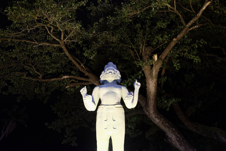 sculpture of a hindu deity with four arms and several facesの写真素材
