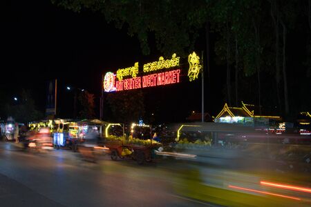 Siem Reap, Cambodia, December 11/2018 night market, traffic on the road, motion blurのeditorial素材