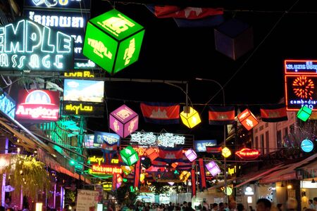 Siem Reap, Cambodia, December 11/2018 brightly decorated with flags and garlands tourist street, Cambodia flags, decorative lighting, pub streetのeditorial素材