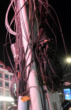 Siem Reap, Cambodia, December 13, 2018 power line cable. Urban communications network.