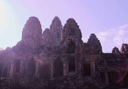 Monumental ancient temple of Bayon in Cambodia. Medieval temple in Indochina. Architectural art of ancient civilizations. Bayon temple in Angkor Thom. Face towers.の写真素材