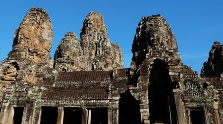 Monumental ancient temple of Bayon in Cambodia. Medieval temple in Indochina. Architectural art of ancient civilizations. Bayon temple in Angkor Thom. Face towers.の写真素材