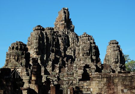 Monumental ancient temple of Bayon in Cambodia. Medieval temple in Indochina. Architectural art of ancient civilizations. Bayon temple in Angkor Thom. Face towers.の写真素材