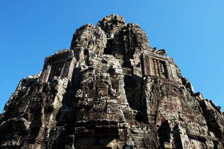 Monumental ancient temple of Bayon in Cambodia. Medieval temple in Indochina. Architectural art of ancient civilizations.の写真素材