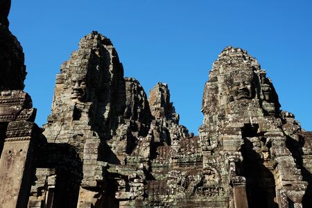 Monumental ancient temple of Bayon in Cambodia. Medieval temple in Indochina. Architectural art of ancient civilizations. Bayon temple in Angkor Thom. Face towers.の写真素材