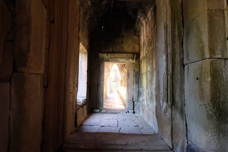 Ancient stone corridor bathed in sunlight. Stone vaults. Ancient stonework.の写真素材