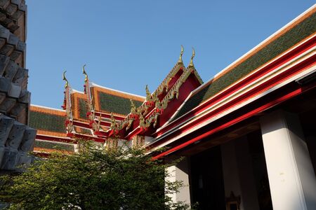 Beautiful roofs of a Buddhist temple. Architectural art of southeast asia.