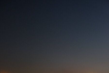 Sky at dusk as a background. Sky painted in different shades of blue.