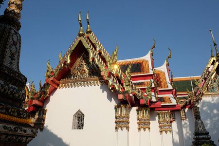 Beautiful roofs of a Buddhist temple. Architectural art of southeast asia.の写真素材