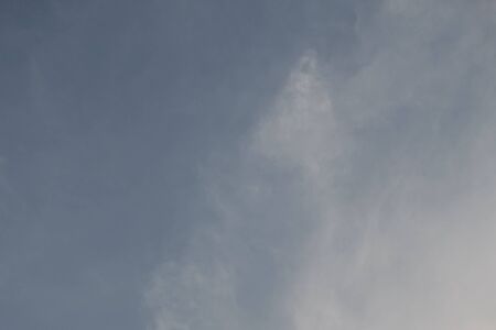 Blue sky with white clouds as a background.