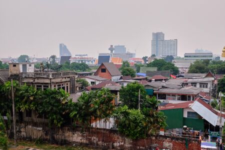 Bangkok, Thailand, December 28, 2018. Beggarly shacks of the Asian metropolis. Slums of the capital of Thailand. City landscape.のeditorial素材