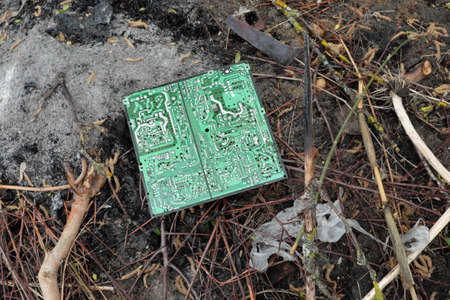 Chernihiv region, Ukraine, May 7, 2019. An old computer circuit board is lying in a garbage dump.