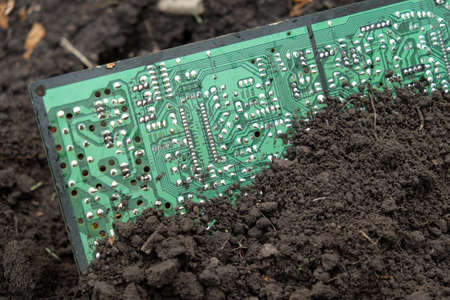 Chernihiv region, Ukraine, May 7, 2019. A large computer circuit board buried in the ground.