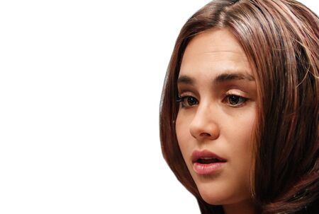 Portrait of an attractive girl on a white background. Copy space. Girl with ajar mouth.の写真素材