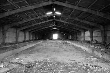Abandoned industrial building. Big empty sty. Old livestock farm.の写真素材