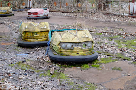 Cars in an abandoned amusement park in Pripyat. Rusty deserted attractions.の写真素材