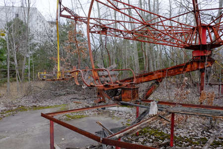 An old broken carousel in the abandoned city of Pripyat. Abandoned amusement park.