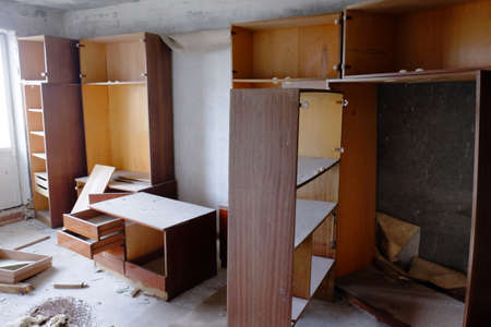 Broken wooden cabinets in an abandoned room. Old Soviet furniture in an abandoned apartment in Pripyat.の写真素材