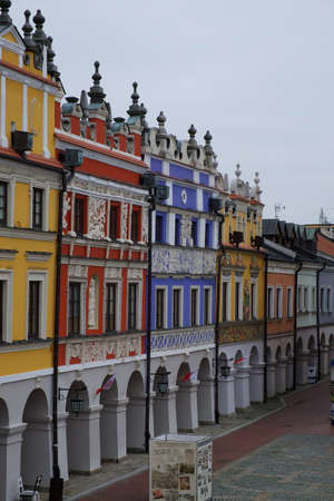 Zamosc, Poland, November 10, 2020. Richly decorated old Renaissance houses in the Polish town of Zamosc. colorful old European houses, tourist attraction. Brightly painted facades of houses.のeditorial素材