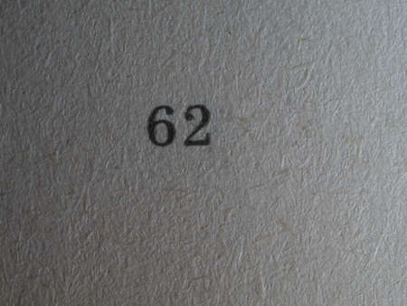 The number 62 printed on a piece of paper. Paper texture.の写真素材