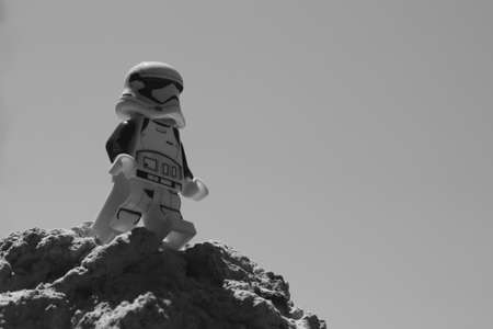 Chernihiv, Ukraine, July 13, 2021. A plastic imperial stormtrooper from Star Wars against a clear sky background. Minifigure close-up. Illustrative editorial. Black and white image.のeditorial素材