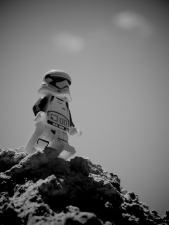 Chernihiv, Ukraine, July 13, 2021. A plastic imperial stormtrooper from Star Wars against a clear sky background. Minifigure close-up. Illustrative editorial. Black and white image.のeditorial素材