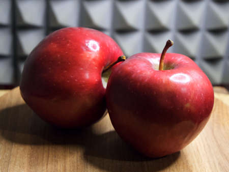 Two red apples of the red chief variety, a close-up shot.