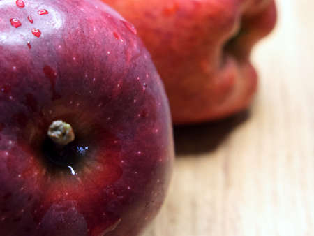 Wet red apple, close-up shot. Place for textの写真素材