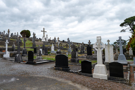 West Cork, Ireland, May 2, 2022. An old Catholic cemetery on a cloudy spring day. stone tombstones. Cemetery of Darrara in Cork County of Ireland. headstoneのeditorial素材