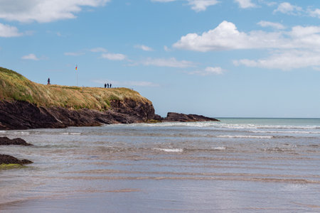 County Cork, Ireland, June 12, 2022. View of the Cape of the Virgin Mary on a sunny day. The rocky Irish coast, rock formation near body of water.の写真素材