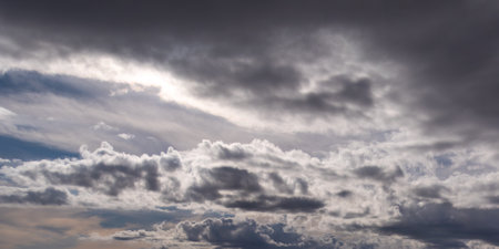Gray cumulus clouds in the sky. Dramatic skies, landscape. The sky is like a background. white...