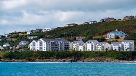 Hotels on the Atlantic Ocean in Ireland in summer. White houses on the hilly seashore, landscape.の写真素材
