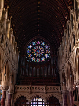 A large multicolored stained glass window in the Roman Catholic Church, city Cobh. The interior of Cathedral Church of St Colman.の写真素材