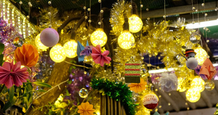 Photographer capturing festive Christmas lanterns and toys, exhibited as part of Christmas decorations.の写真素材