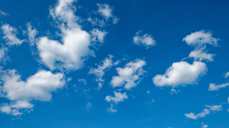 Little cumulus clouds on a blue sky. background.の写真素材