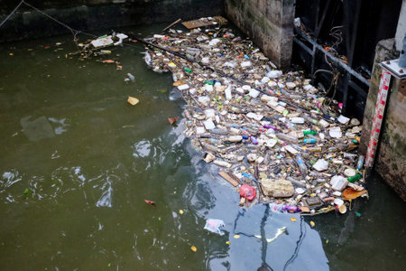Bangkok, Thailand, December 28, 2018. A polluted body of water filled with trash, including plastic...