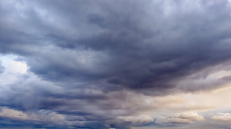 The image shows dark, ominous clouds covering the sky, indicating an approaching storm.の写真素材