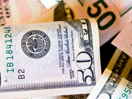 US Dollar Bills. Various denominations of US dollars, rolled and flat.の写真素材