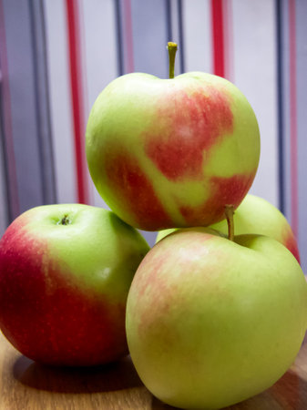Fresh Apple Assortment. A selection of apples on a wooden surface, ideal for health and nutrition content.の写真素材