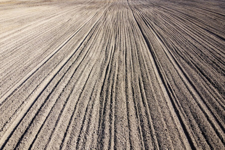 Plowed agricultural field, aerial view. Agricultural land. Background.の写真素材