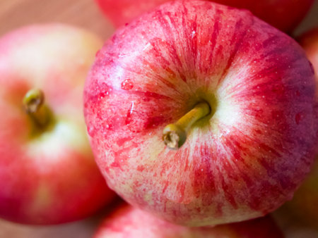 Ripe Apples Close-Up. Detailed view of red apples with natural patterns.の写真素材