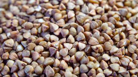 Buckwheat Texture Display. A close-up of buckwheat grains, emphasizing shape and color, great for educational materials.の写真素材